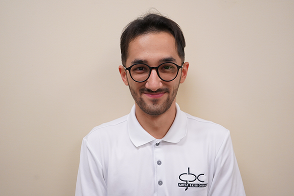 Photograph of Muhammed Salikhov in white GBC polo.